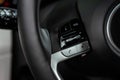 Multiple buttons on the steering wheel to accept or reject calls from the phone close up view. Royalty Free Stock Photo