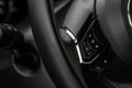 Multiple buttons on the steering wheel to accept or reject calls from the phone close up view. Royalty Free Stock Photo