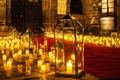 Multiple candles on the floor inside the church.