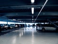Multiple cars parked inside the large multi-level parking