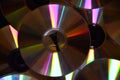 Multiple CD or DVD discs closeup on pile