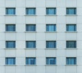 Multiple closed windows on a large office building Royalty Free Stock Photo