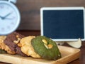 Multiple color cookies inclusive peanut butter, green tea cookies, and Chocolate Chip Cookies. Overlaid by alternating colors on w Royalty Free Stock Photo