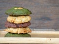 Multiple color cookies inclusive peanut butter, green tea cookies, and Chocolate Chip Cookies. Overlaid by alternating colors onMu Royalty Free Stock Photo