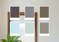 Multiple color shades against view of mirror and plant in the living room