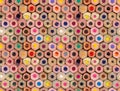 Multiple colored wooden crayons bottom arranged in seamless pattern, abstract backdrop, soft focus close up Royalty Free Stock Photo