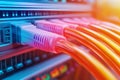 Multiple colorful Ethernet cables connected to a server rack symbolizing reliable high speed internet and data transmission in