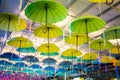 Multiple Colorful Umbrellas Hanging From The Roof