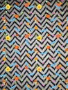 It is a multiple coloured background wool full frame pattern seamless pattern close up