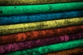 Multiple colours painted on some stack of metallic pipes