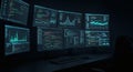 Multiple Computer Monitors Displaying Financial Charts and Data in Dark Office Setting Royalty Free Stock Photo