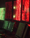 Multiple Computer Monitors Displaying Green and Red Code Royalty Free Stock Photo