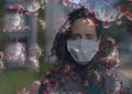 Multiple covid-19 cells against portrait of caucasian woman wearing face mask