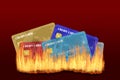 Burning Credit Cards With Fire and Smoke Isolated on Red Background