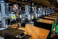 Multiple 3D printers operate simultaneously on shelves in a factory or production facility, showcasing modern manufacturing Royalty Free Stock Photo