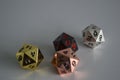 Multiple d20 twenty sided dice die copper silver gold black