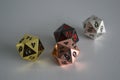 Multiple d20 twenty sided dice die copper silver gold black