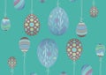 Multiple decorative colorful easter eggs hanging to string against green background