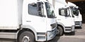 Multiple delivery small van white transportation truck park Royalty Free Stock Photo