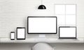 Multiple devices on office desk for responsive web site design presentation Royalty Free Stock Photo