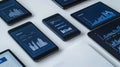 Digital devices displaying data charts and information against white background Royalty Free Stock Photo
