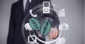 Multiple digital icons around leaves against mid section of businessman touching invisible screen