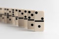 Dominos falling on a white background Royalty Free Stock Photo