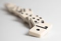 Dominos falling on a white background Royalty Free Stock Photo