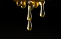 Multiple Drops of Honey String from Drizzler Royalty Free Stock Photo