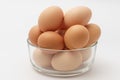 Multiple eggs in a glass bowl