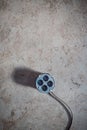 Multiple electrical sockets with four outlets isolated on the grey concrete floor, four outlet power strip Royalty Free Stock Photo