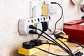 Multiple electricity plugs on adapter risk overloading and dange Royalty Free Stock Photo