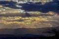 Sun hiding behind some dense clouds