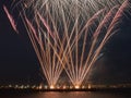 Multiple fireworks burst in the night sky with light trails Royalty Free Stock Photo