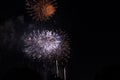 Multiple Fireworks in night sky in a composition in shades red and white Royalty Free Stock Photo