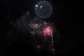 Multiple Fireworks in night sky in a composition in shades red and white Royalty Free Stock Photo