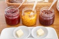Multiple flavor of Jam and fresh butter for eat with bread morning meal preparing set on the table Royalty Free Stock Photo