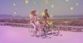 Multiple golden star icons against caucasian senior couple riding bicycles together at the beach Royalty Free Stock Photo