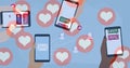 Multiple heart icons floating against hands using smartphones against blue background