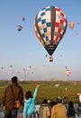 Multiple hot air balloons lift off