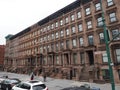 Multiple houses situated on the Malcolm X Boulevard in Manhattan. Royalty Free Stock Photo