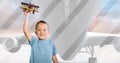 Multiple image of airplane flying in sky and portrait of caucasian smiling boy flying toy airplane