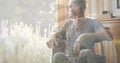 Multiple image of caucasian senior man sitting on wheelchair and senior woman gardening in yard Royalty Free Stock Photo