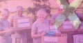 Multiple image of caucasian seniors holding donation boxes and awareness ribbon