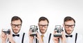 Multiple image of man using retro camera