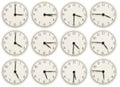 Set of office clocks showing various time isolated on white background Royalty Free Stock Photo