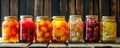 Multiple jars filled with various types of fruit, showcasing an assortment of canned fruits and vegetables lined up in a row Royalty Free Stock Photo