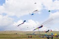 Multiple kites flying high in the countryside Royalty Free Stock Photo