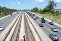 Multiple lane highway with rail tracks