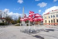 Multiple Latvia flags waving in wind
